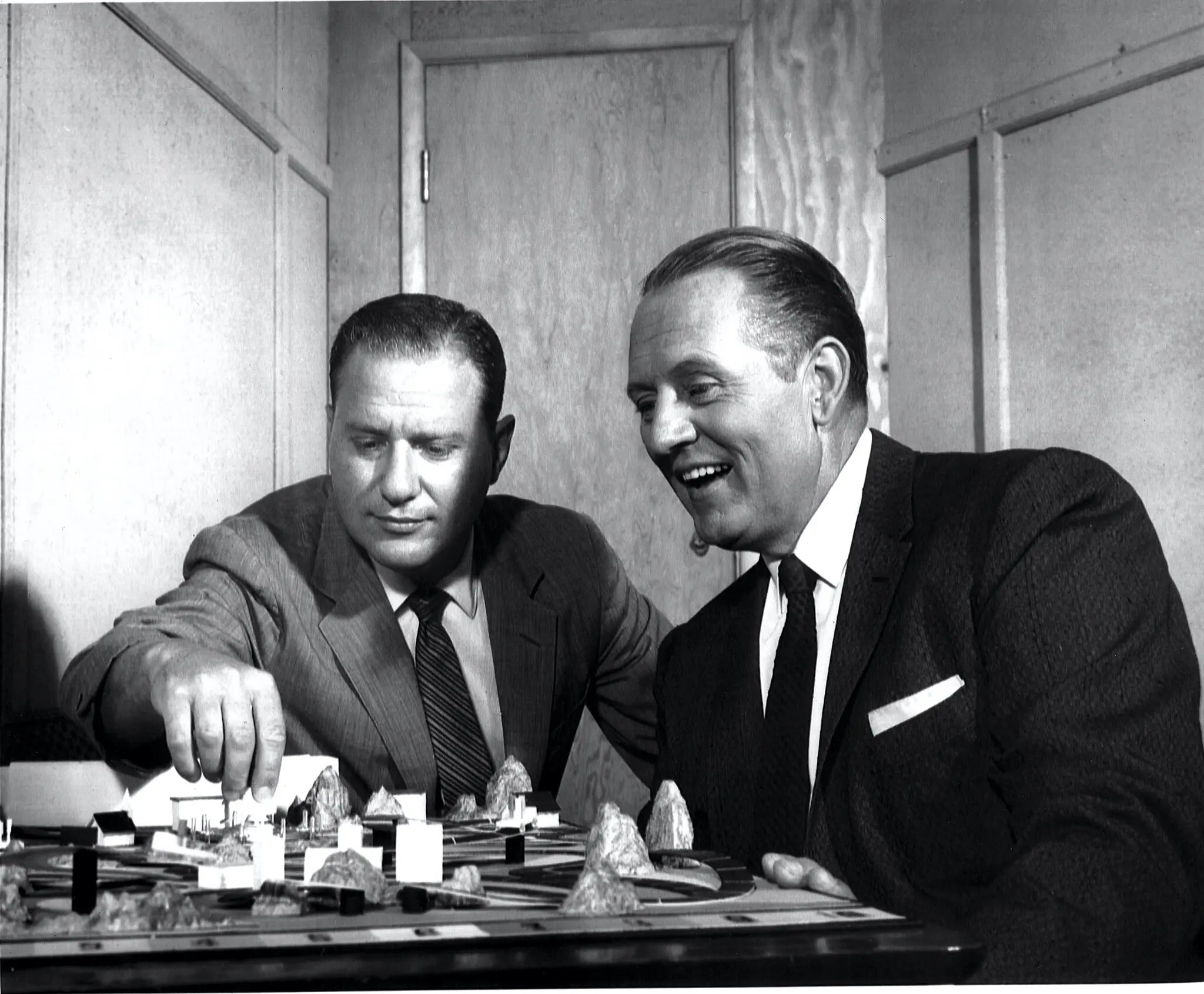 Reuben Klamer, left, and Art Linkletter examining The Game of Life board game